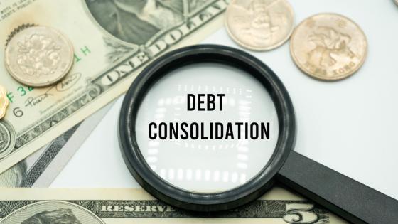 Magnifying glass over words "debt consolidation"
