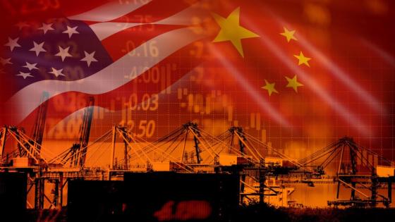 The Chinese and US flags loom over a trading port 