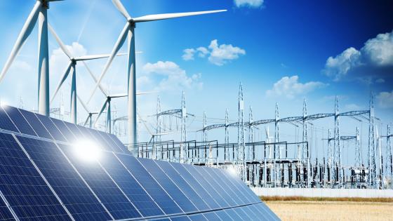 Solar panels and wind turbines connected to energy grid