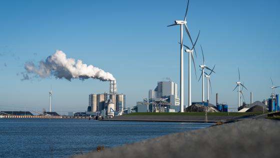 Fossil fuel (coal) power station and wind turbines in the Eemshaven generating power
