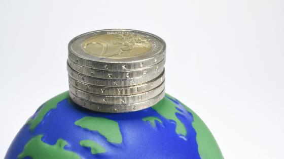 Image of stack of euro coins on top of globe