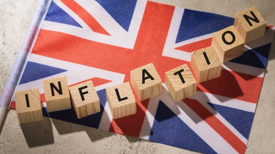British flag and wooden cubes spelling out "inflation"