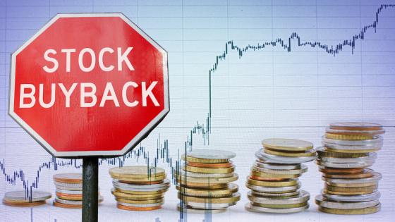 Stock buyback sign against chart and coins