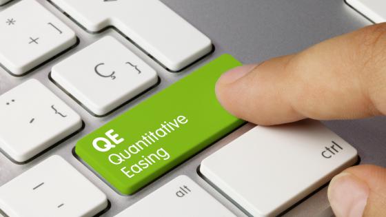 Green quantitative easing key on computer keyboard