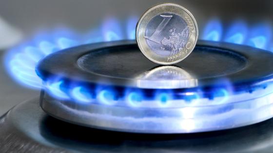 Euro coin on lit gas hob