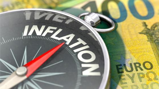 Compass pointing to inflation on top of euro note