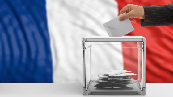 Ballot box with French flag in background