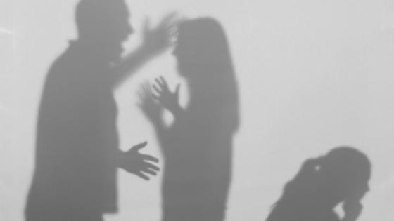 Silhouettes of quarreling parents and child