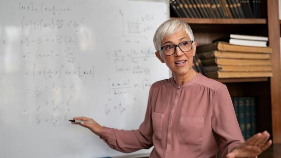 Female professor teaching maths