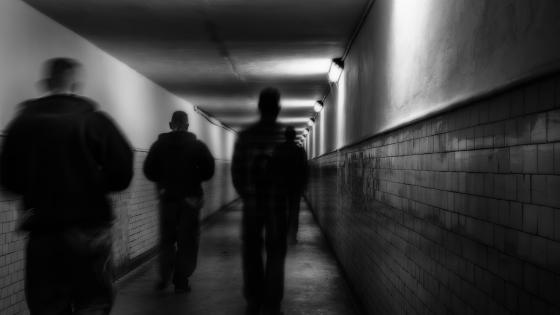 Young people walking through tunnel