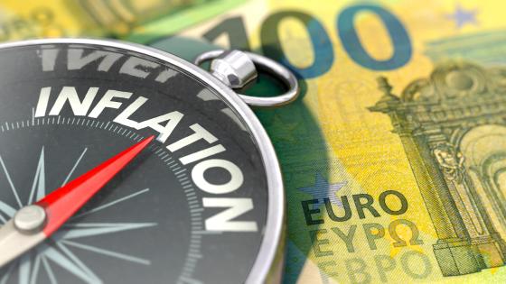 Inflation on compass on top of euro notes