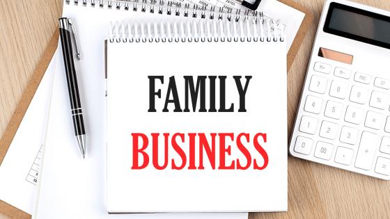 "Family business' written on notepad next to calculator