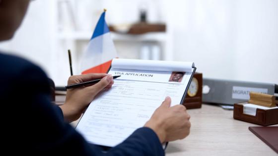 French Official looking at Immigrant Application