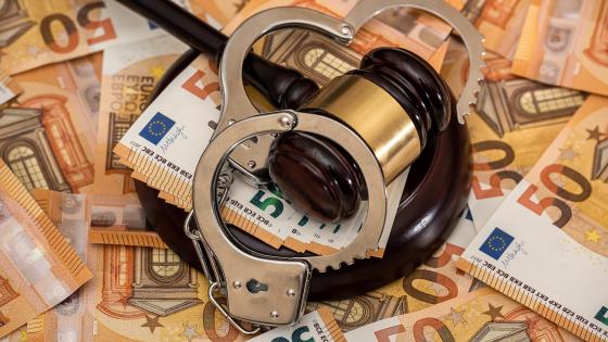 handcuffs, gavel and euro banknotes