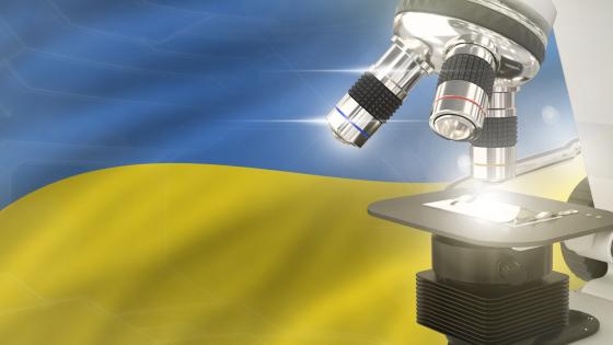 Microscope with Ukraine flag in background