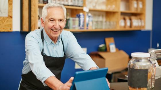 Older worker in coffee shop