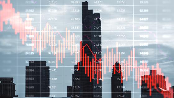 Red graph falling with financial buildings in the background