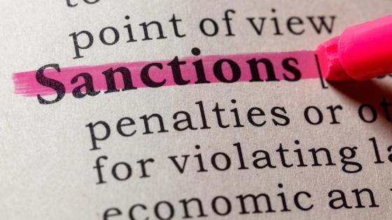 The word 'sanctions' highlighted in the dictionary 