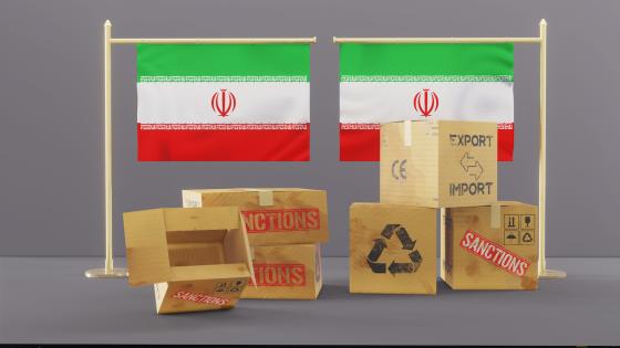 Iranian flags with boxes with sanctions written on them