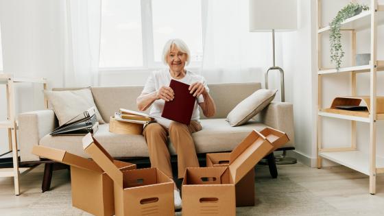 Woman packing boxes to move home