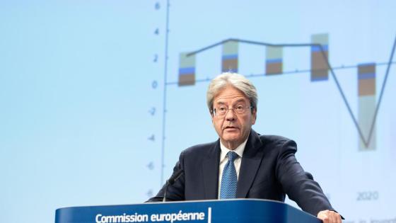 Paolo Gentiloni, European Commissioner for Economy, speaking at a podium.