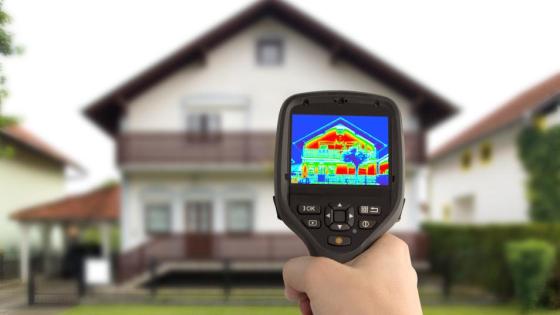 Handheld Thermal Camera surveys a house