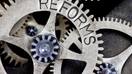 Reforms written on cogs