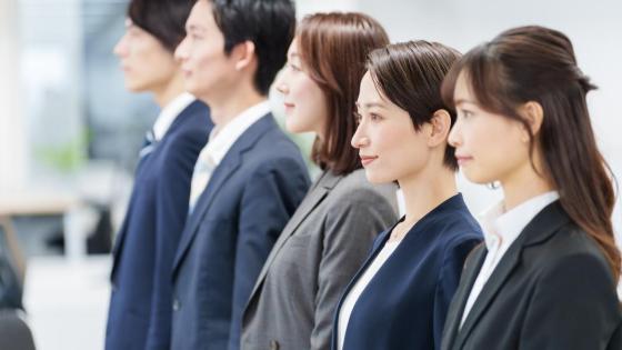 Japanese employees stand in a line
