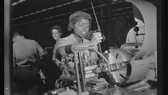 Young black woman working on an aircraft engine during World War 2