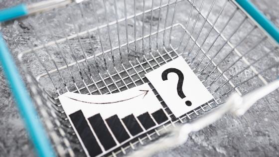 Empty shopping basket with chart and question mark